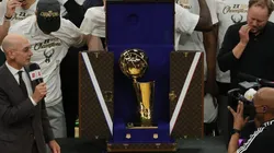 NBA commissioner Adam Silver presents the NBA title trophy at the 2021 NBA Finals