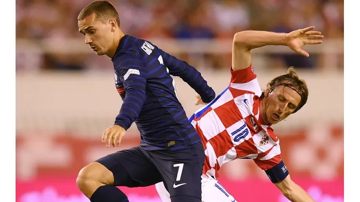 Antoine Griezmann of France and Luka Modric of Croatia