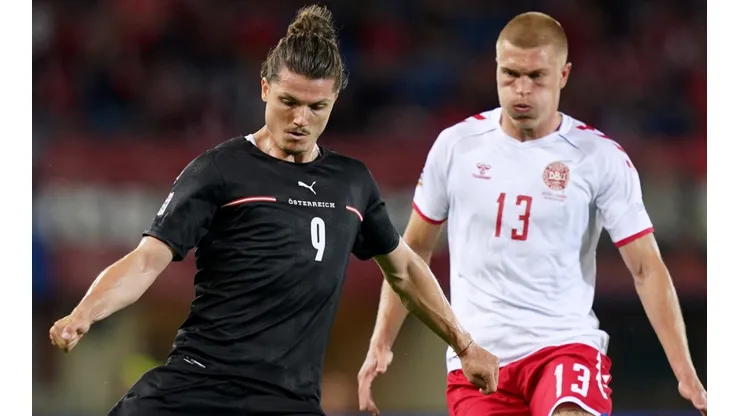 Marcel Sabitzer of Austria and Rasmus Kristensen of Denmark