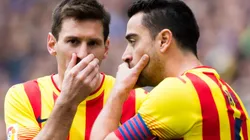 Lionel Messi and Xavi Hernandez of Barcelona