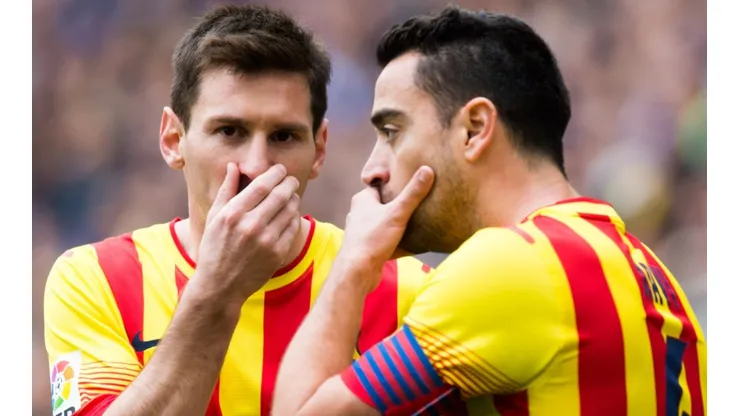 Lionel Messi and Xavi Hernandez of Barcelona