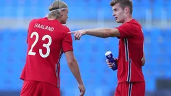 Erling Haaland of Norway speaks with team mate Patrick Berg