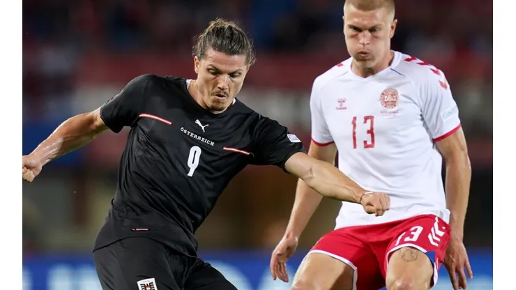 Marcel Sabitzer of Austria and Rasmus Kristensen of Denmark