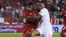 Fidel Escobar of Panama fights for the ball with Cyle Larin of Canada