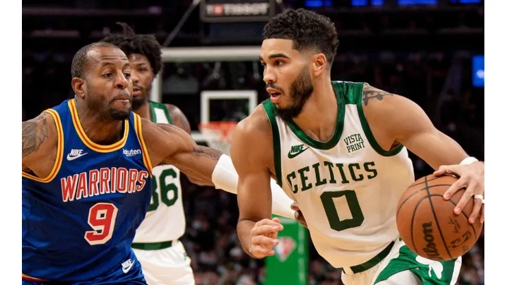 Jayson Tatum of the Boston Celtics and Andre Iguodala of the Golden State Warriors