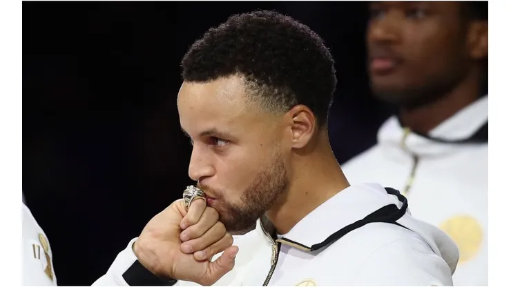 Stephen Curry of the Golden State Warriors kisses his NBA Championship ring