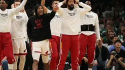 Members of Miami Heat bench react against the Boston Celtics