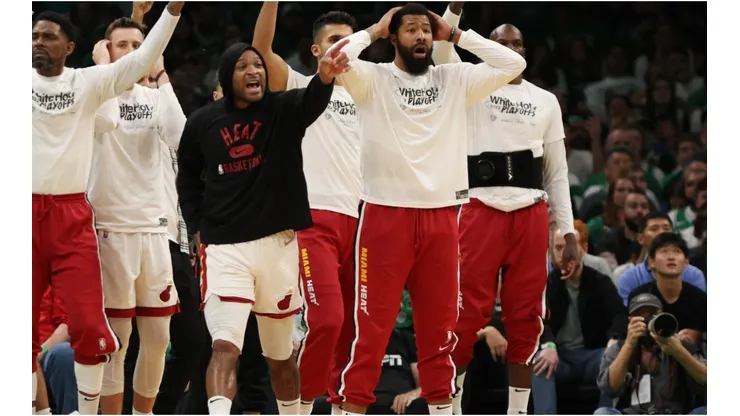 Members of Miami Heat bench react against the Boston Celtics
