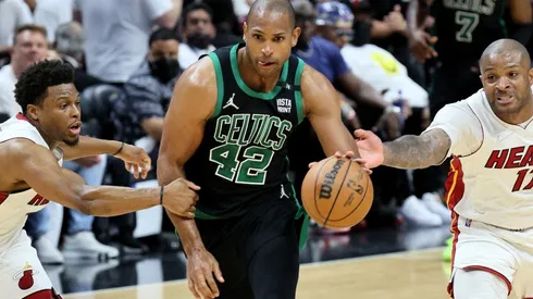 Al Horford of the Boston Celtics against Kyle Lowry and P.J. Tucker of the Miami Heat