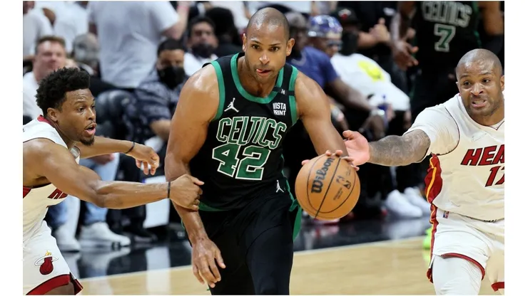 Al Horford of the Boston Celtics against Kyle Lowry and P.J. Tucker of the Miami Heat