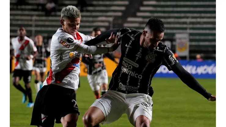 Sergio Adrian of Always Ready and Renato Augusto of Corinthians