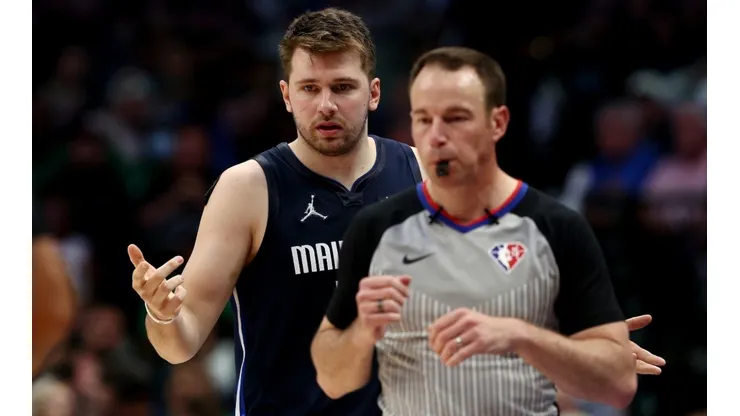 Luka Doncic of the Dallas Mavericks argues with referee Josh Tiven