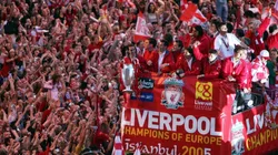 Liverpool team rides on an open top bus through a mass of fans as they arrive at St. George's Hall during the Liverpool Champions League Victory Parade on May 26, 2005