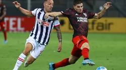 Julian Alvarez of River Plate fights for the ball with Pablo Lavandeira of Alianza Lima