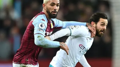 Douglas Luiz of Aston Villa and Bernardo Silva of Manchester City