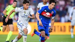 Exequiel Zeballos of Boca Juniors drives the ball against Sebastian Prediger of Tigre