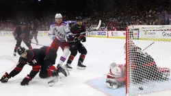 Kaapo Kakko #24 of the New York Rangers watches a first period shot by Filip Chytil #72 (not shown) get past Antti Raanta #32 of the Carolina Hurricanes