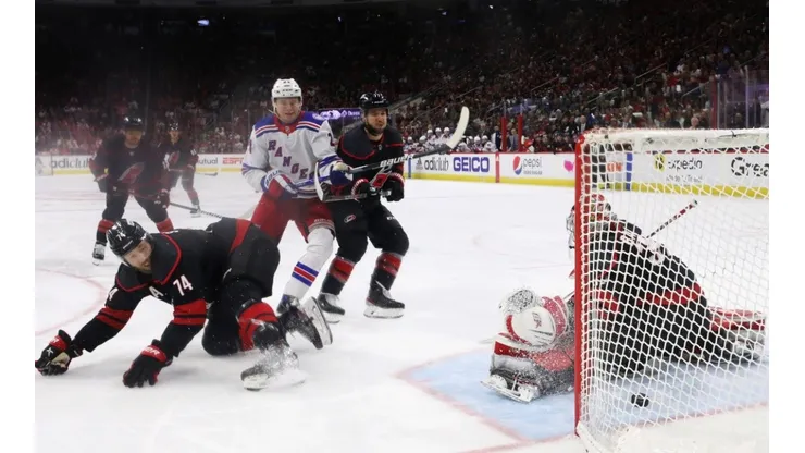 Kaapo Kakko #24 of the New York Rangers watches a first period shot by Filip Chytil #72 (not shown) get past Antti Raanta #32 of the Carolina Hurricanes