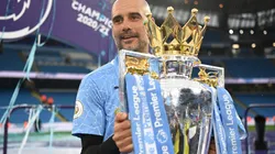 Pep Guardiola celebrates with the 2021-22 Premier League Trophy