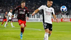 Óscar Opazo of Colo Colo controls the ball against Julián Álvarez of River Plate