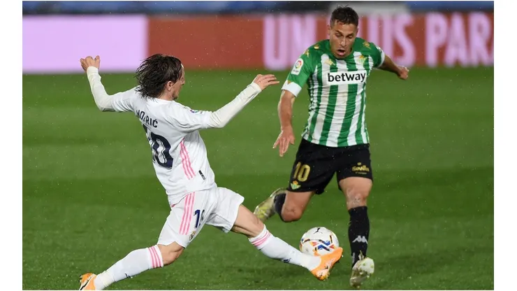 Luka Modric of Real Madrid and Sergio Canales of Real Betis
