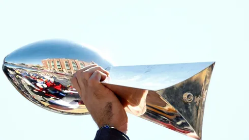 Andrew Whitworth #77 of the Los Angeles Rams raises the Vince Lombardi