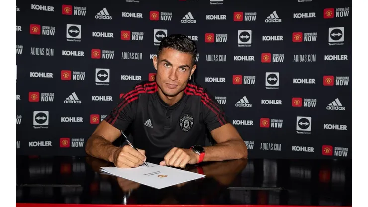 Cristiano Ronaldo of Manchester United poses after signing his contract with the club at Carrington Training Ground on September 08, 2021 in Manchester, England.