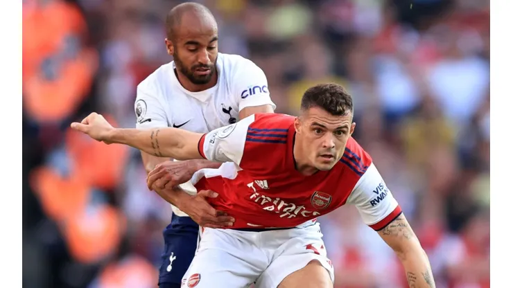 Lucas Moura of Tottenham and Granit Xhaka of Arsenal