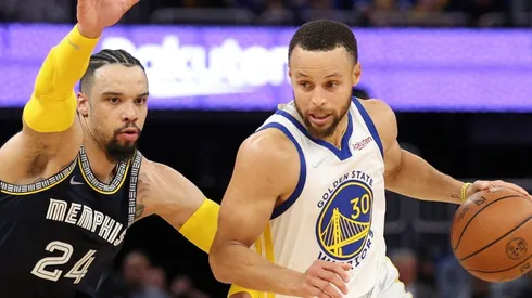 Stephen Curry of the Golden State Warriors is guarded by Dillon Brooks of the Memphis Grizzlies
