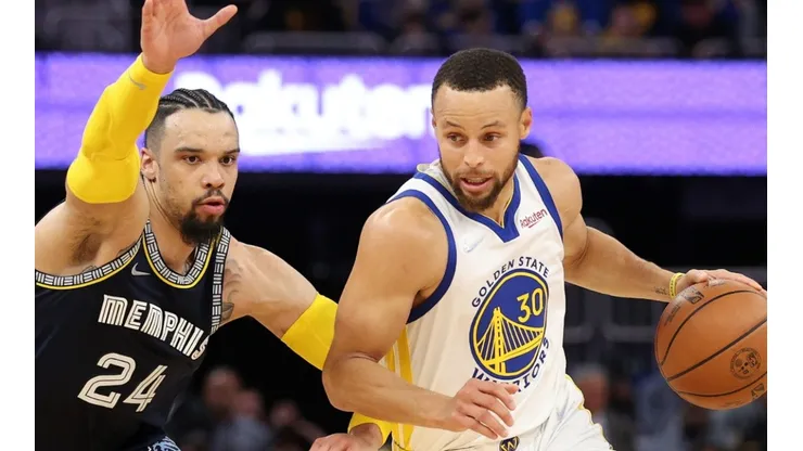 Stephen Curry of the Golden State Warriors is guarded by Dillon Brooks of the Memphis Grizzlies