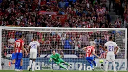 Yannick Carrasco of Atletico Madrid scores
