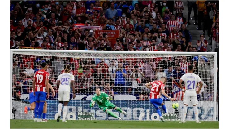 Yannick Carrasco of Atletico Madrid scores