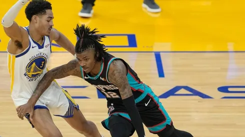 Jordan Poole guarding Ja Morant.