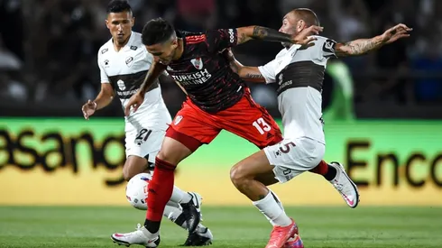 Enzo Fernandez of River Plate fights for the ball with Hernan Lamberti of Platense