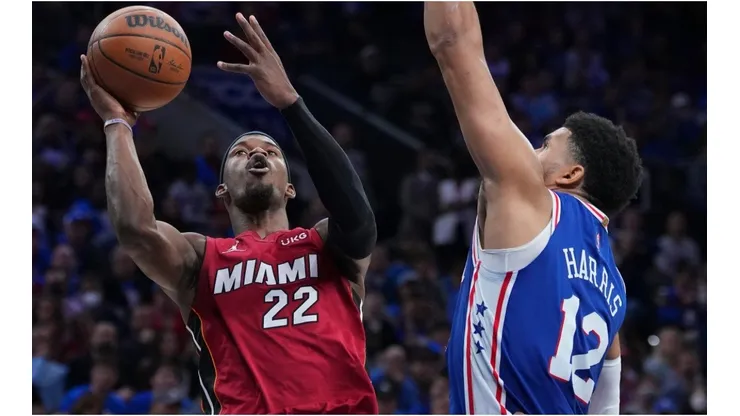Jimmy Butler of the Miami Heat shoots the ball against Tobias Harris of the Philadelphia 76ers