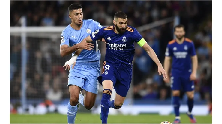 Rodri of Manchester City and Karim Benzema of Real Madrid