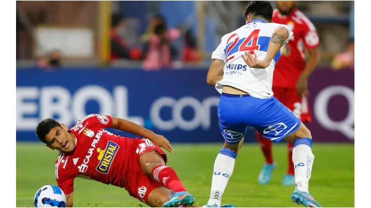 Alfonso Parot of Universidad Catolica fights for the ball with Irven Avila of Sporting Cristal