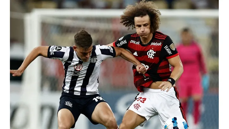 David Luiz of Flamengo competes for the ball with Girotti of Talleres