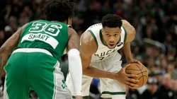 Giannis Antetokounmpo of the Milwaukee Bucks looks to drive on Marcus Smart of the Boston Celtics