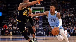 Ja Morant of the Memphis Grizzlies goes to the basket against Andre Iguodala of the Golden State Warriors