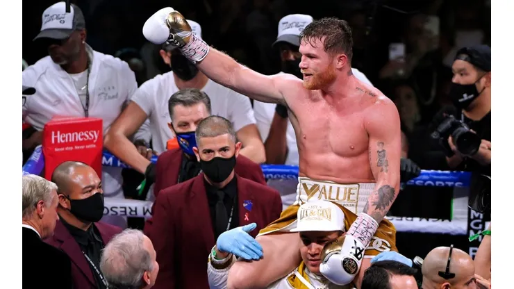 Canelo Alvarez celebrates his victory against Caleb Plant in November 2021