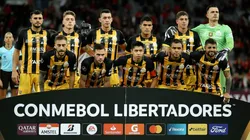 Players of The Strongest pose for photographers