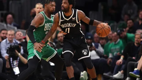 Marcus Smart of the Boston Celtics defends Kyrie Irving of the Brooklyn Nets