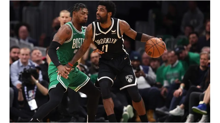 Marcus Smart of the Boston Celtics defends Kyrie Irving of the Brooklyn Nets
