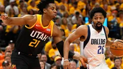 Spencer Dinwiddie of the Dallas Mavericks drives around Hassan Whiteside of the Utah Jazz
