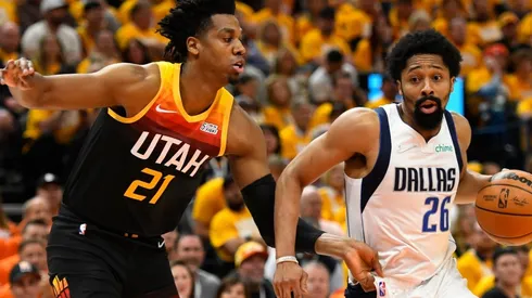 Spencer Dinwiddie of the Dallas Mavericks drives around Hassan Whiteside of the Utah Jazz
