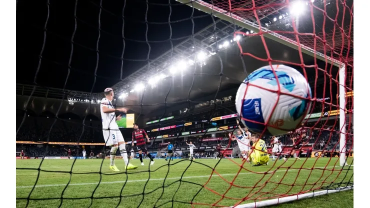 : Ivan Kelava of Melbourne Victory watches the ball go past him into the goal during the A-League soccer