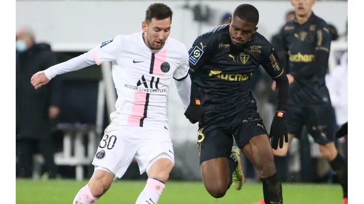 Lionel Messi of PSG and David Pereira Da Costa of Lens