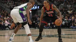 DeMar DeRozan of the Chicago Bulls is defended by Khris Middleton of the Milwaukee Bucks
