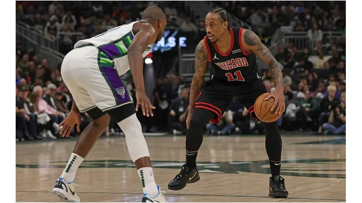 DeMar DeRozan of the Chicago Bulls is defended by Khris Middleton of the Milwaukee Bucks